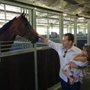 Neil Francis and daughter Sophie at the Rosehill stables, giving their horse Traitor some attention...